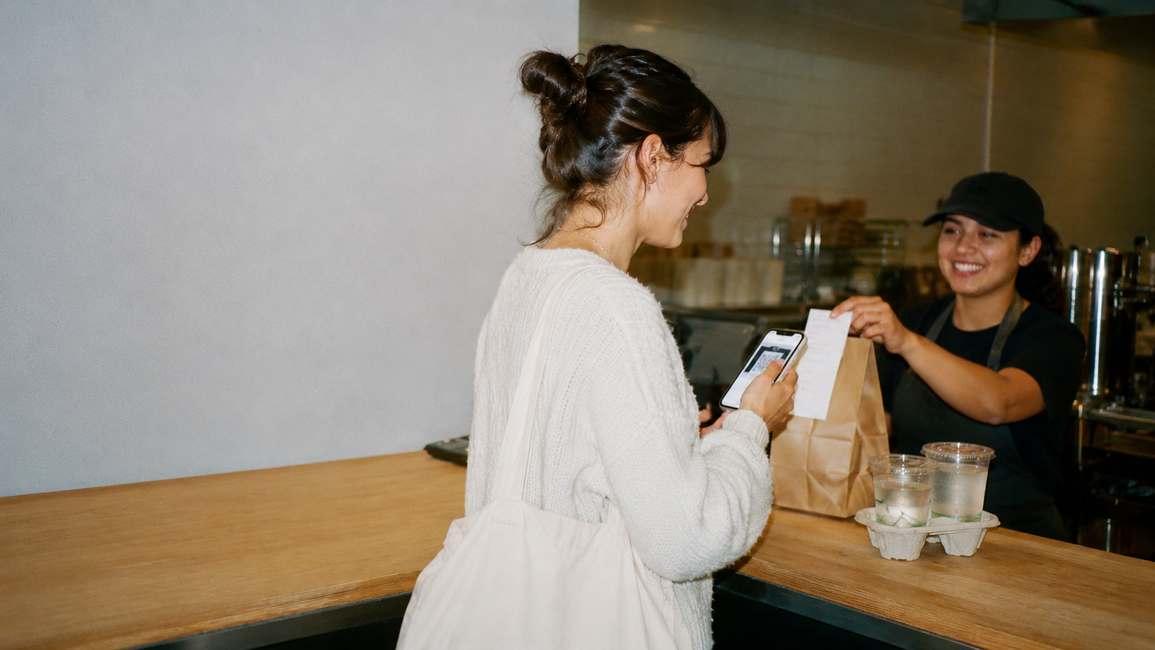 Guest paying at the counter of a quick-service restaurant